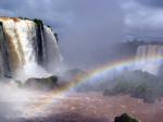 A rainbow forms over Iguassu Falls.